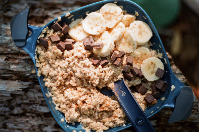 Bowl of oatmeal with chocolate chips and banana