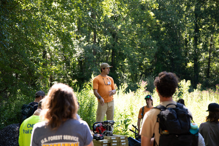 a group of people helping build a boardwalk. text reads 