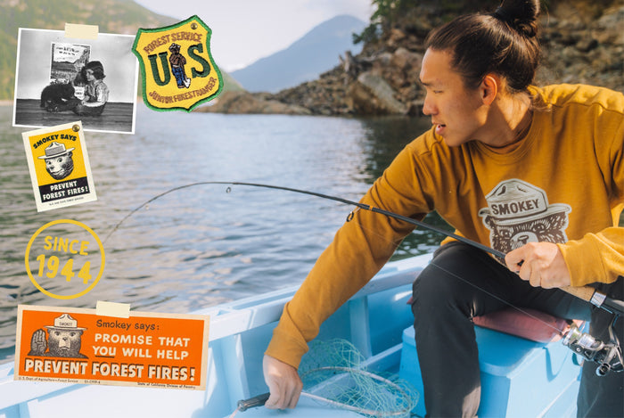 Man fishing in Smokey Bear sweatshirt with vintage collage elements around Happy 79th Birthday Smokey sign