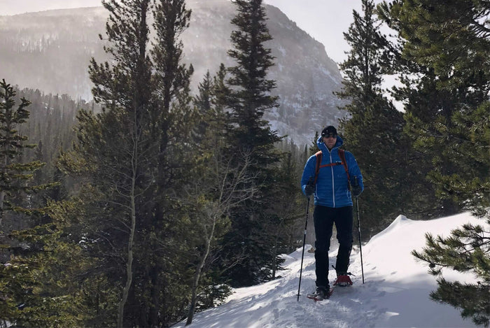 Man snowshoeing in CO